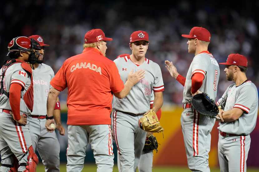 Canada pitcher Mitch Bratt, center right, exits during the first inning of a World Baseball...