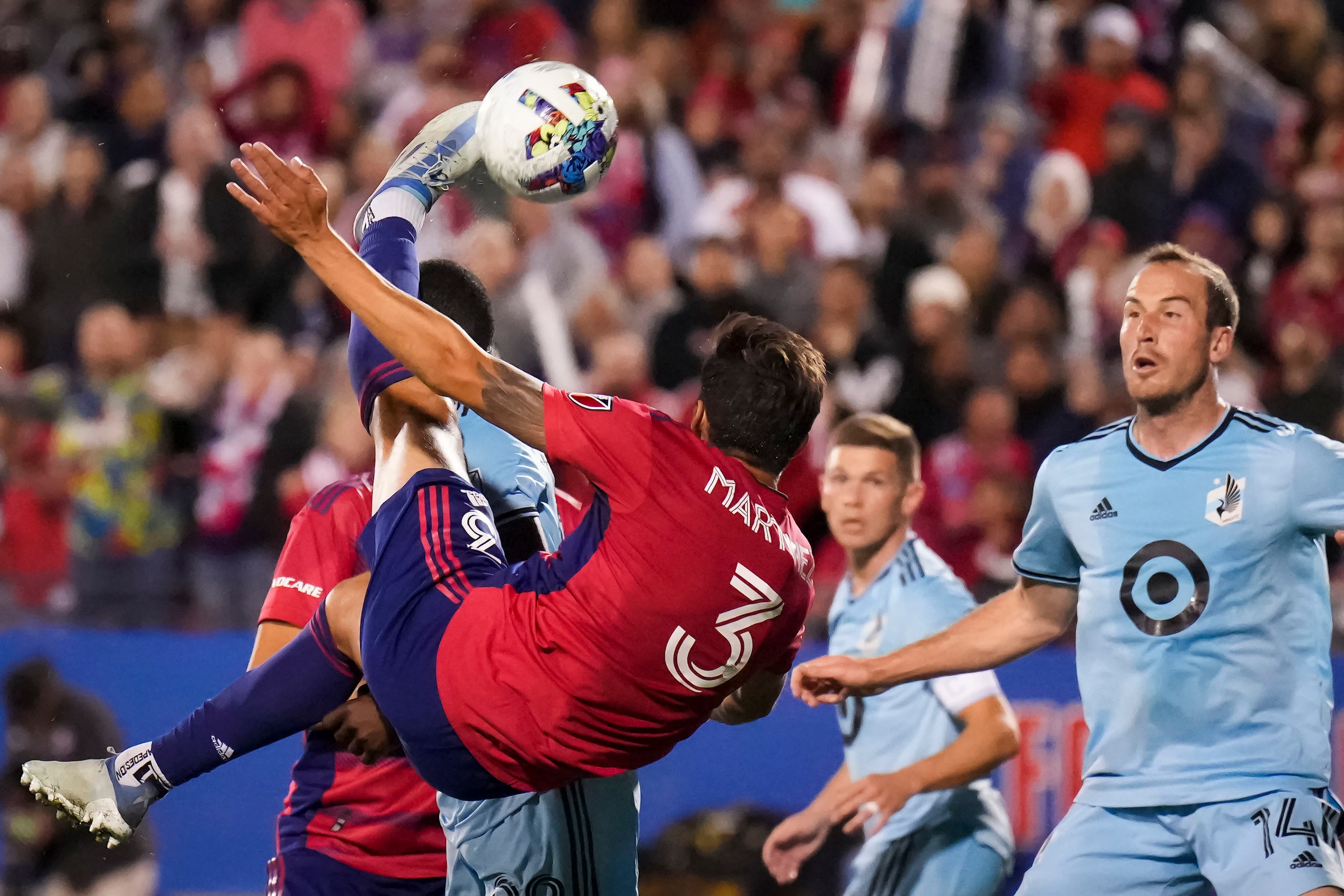 FC Dallas defender José Antonio Martínez (3) attempts a shot with a bicycle kick in front of...