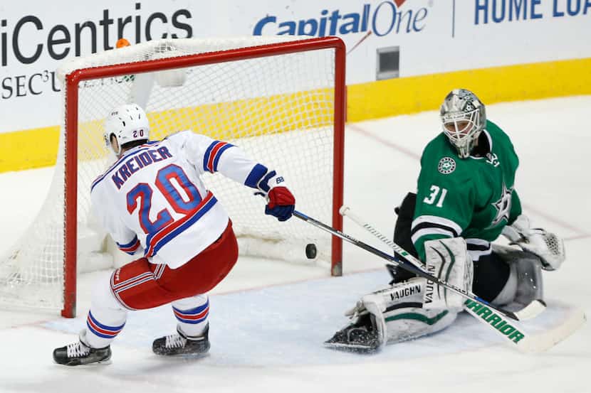 Dallas Stars goalie Antti Niemi (31) makes a save on the New York Rangers' Chris Kreider...