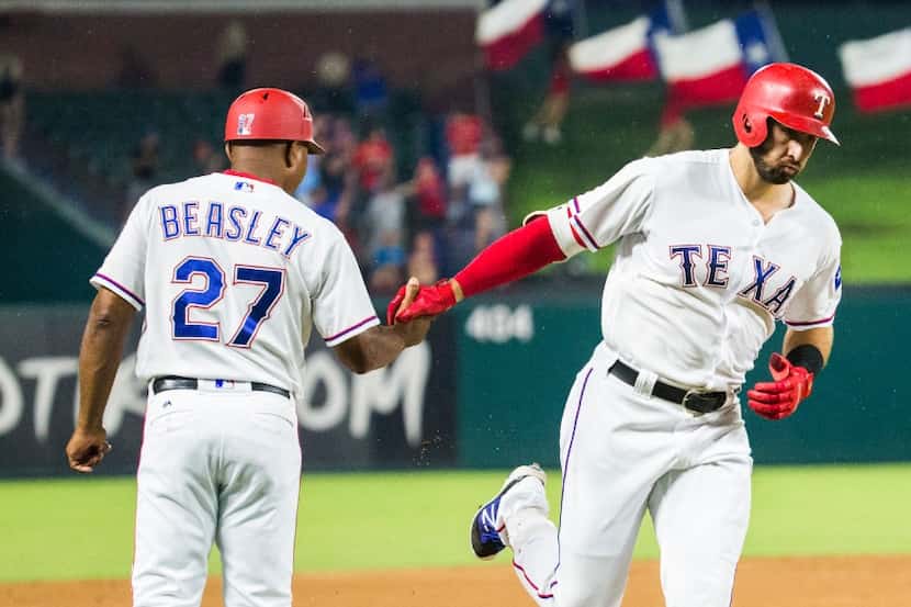 FILE — Texas Rangers OF Joey Gallo (13) shakes hands with third base coach Tony Beasley (27)...