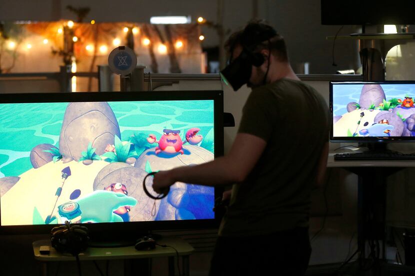 Game designer Alessandro Kitchener demonstrates a VR title called Island Time at Flight...