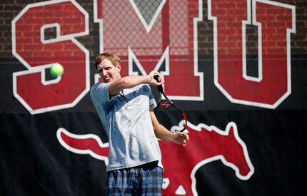 Dallas Mavericks forward Dirk Nowitzki returns the ball while practicing with Grand Slam...