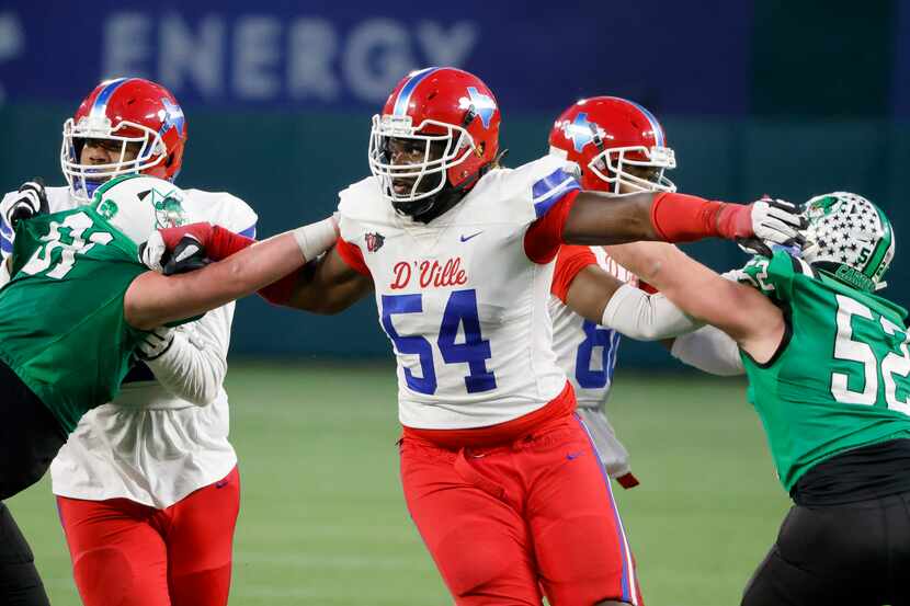 Duncanville’s Savion Byrd (54) tries to get past Southlake players during the Class 6A...