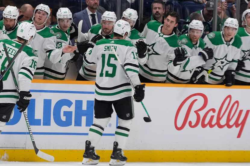 Dallas Stars center Craig Smith (15) celebrates a goal with teammates during the first...