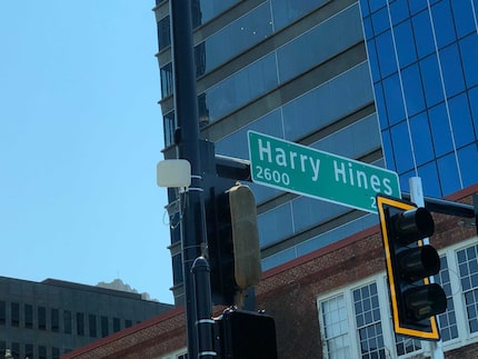 A white panel along Harry Hines Boulevard that monitors the intersection for traffic signals.