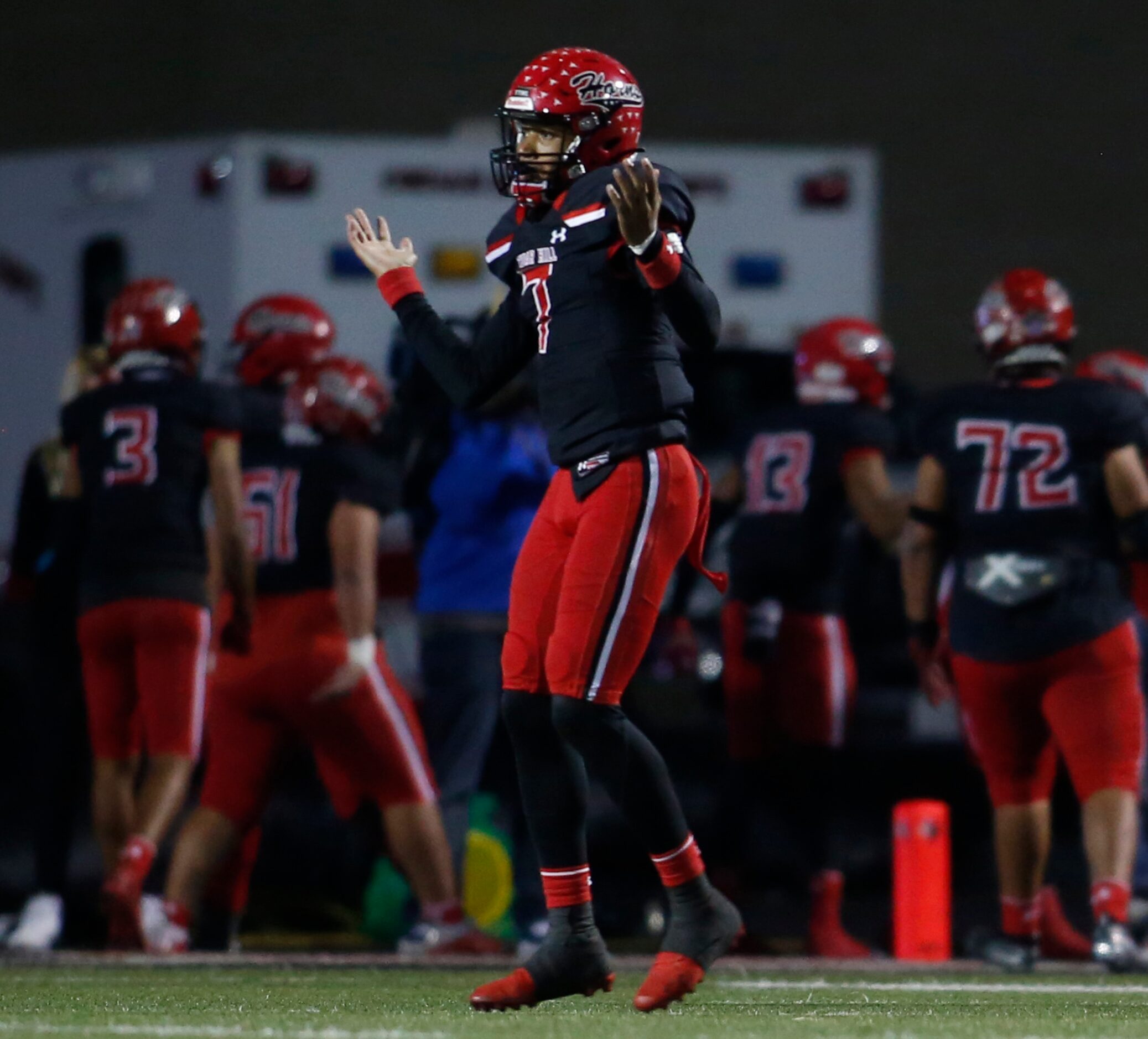 Cedar Hill quarterback Kaidon Salters (7) gestures toward the DeSoto team bench area after...