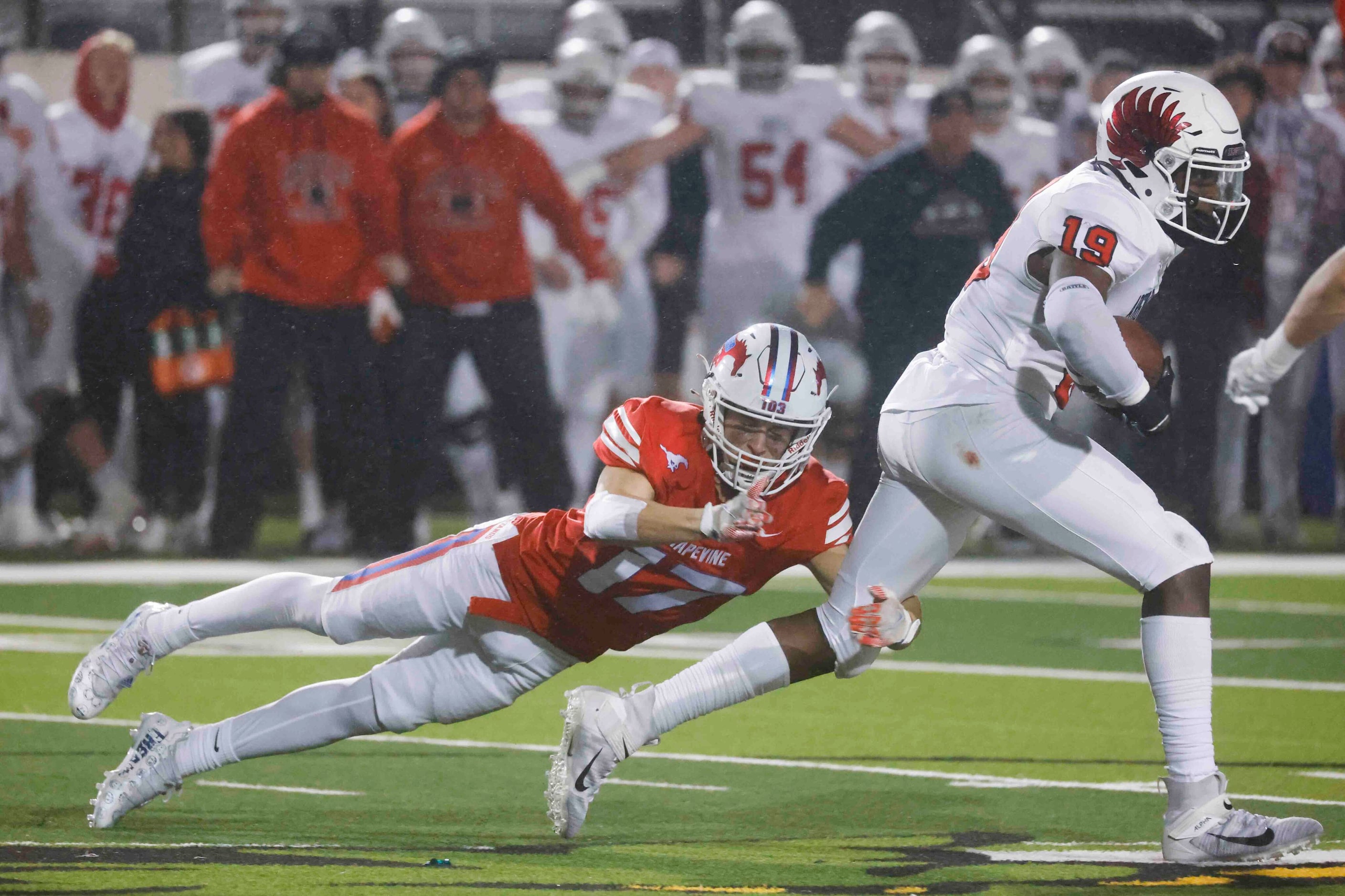 Grapevine High’s Sammy Kelley (17), left, tackles Argyle High’s Jaaqwan Felton (19) as he...