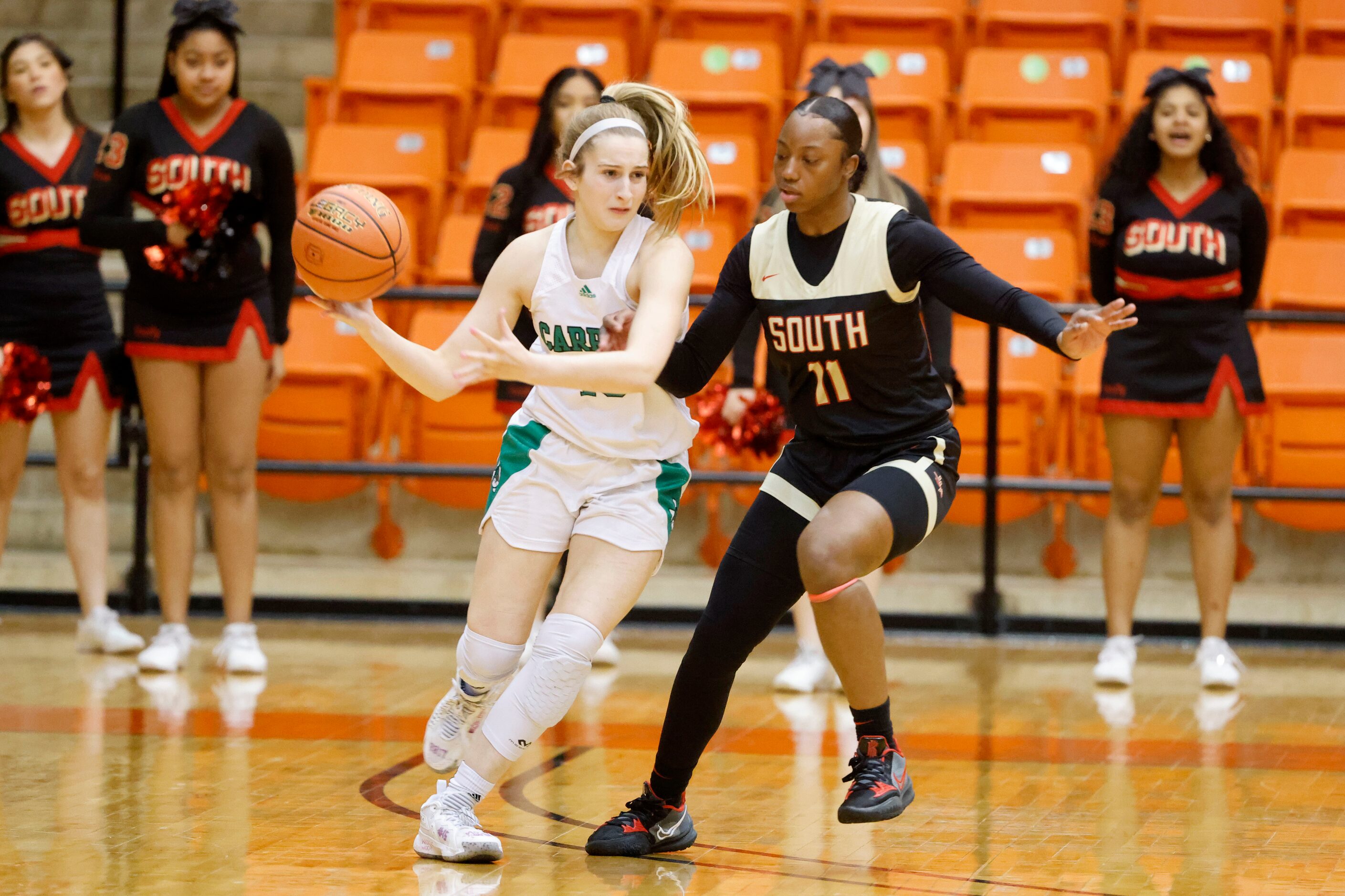 Southlake Carroll’s Emily Berutti, is defended by South Grand Prairies’ Jahcelyn Hartfield...