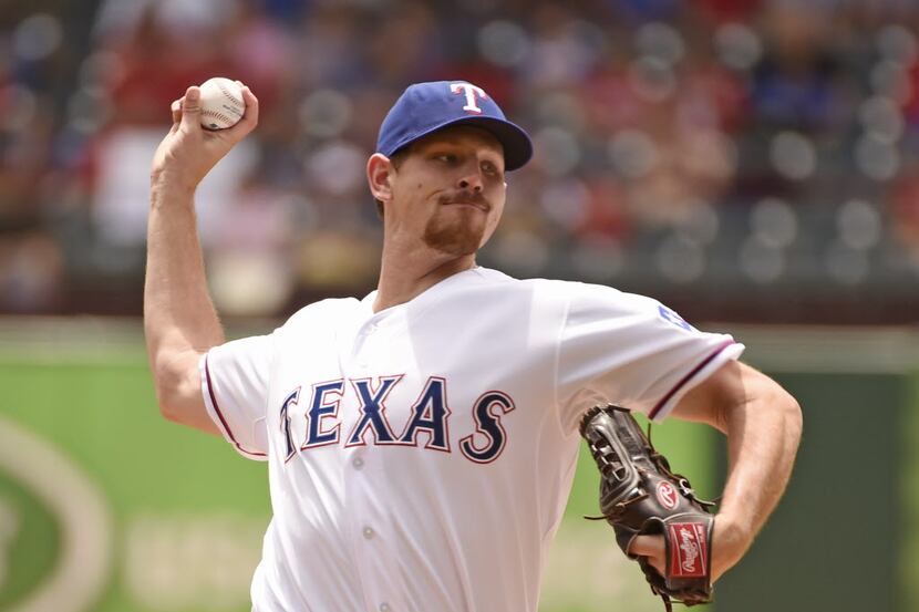 Texas Rangers starting pitcher Nick Tepesch (23) pitches against the Seattle Mariners during...