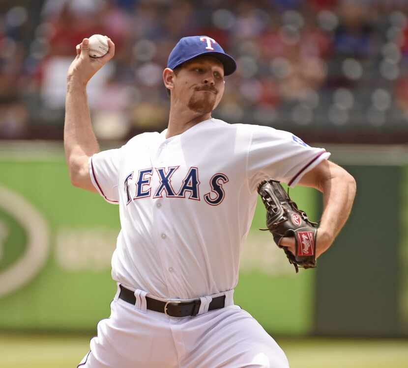 Texas Rangers starting pitcher Nick Tepesch (23) pitches against the Seattle Mariners during...
