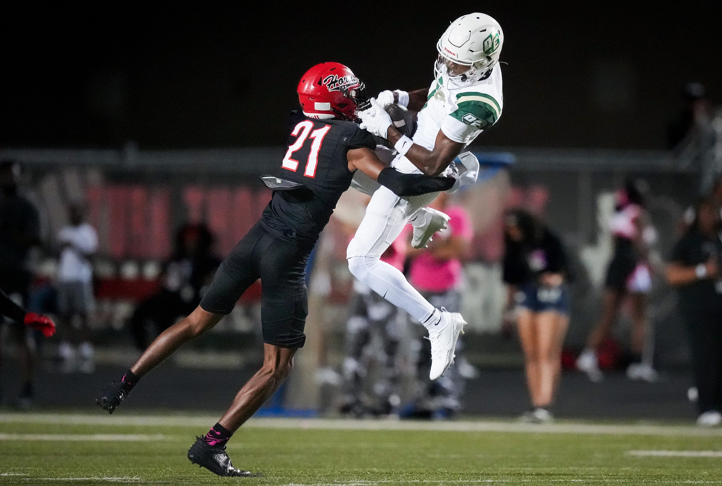 DeSoto wide receiver Ethan Feaster (7) makes a catch as Cedar Hill defensive back Marion...