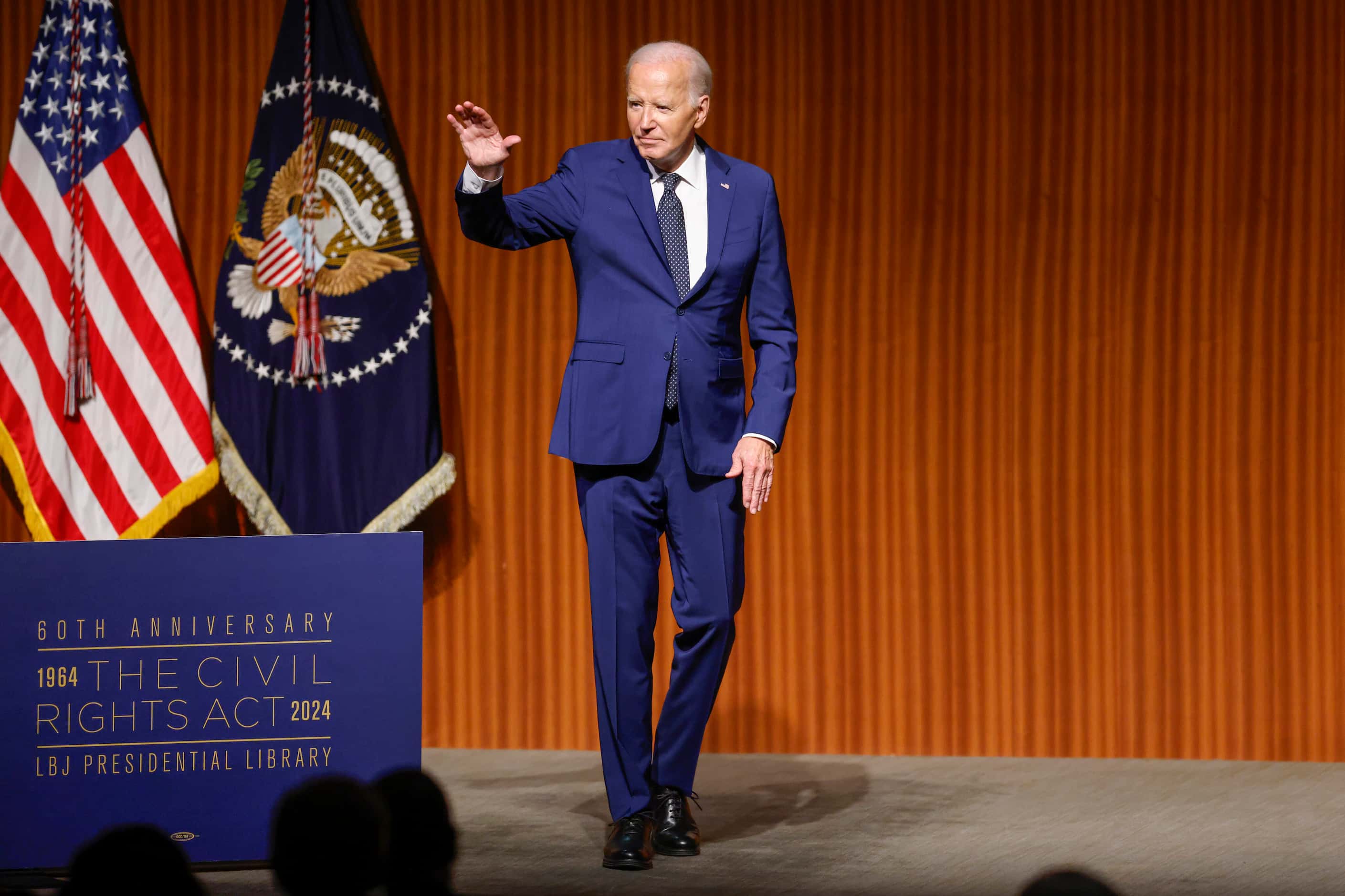 President Joe Biden waves after giving the keynote address during an event commemorating the...