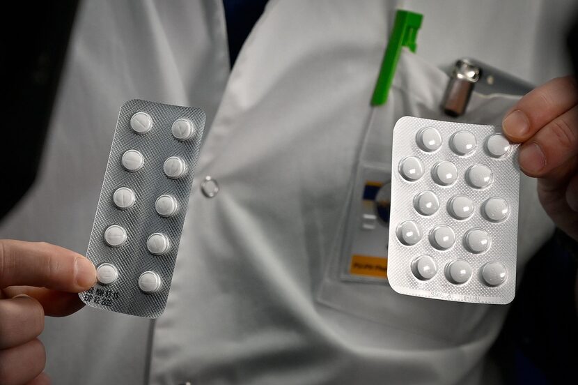 Medical staff at the IHU Mediterranee Infection Institute in Marseille show packets of...