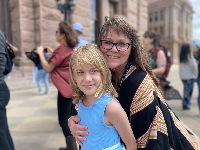 Kai Shappley, an 11-year-old transgender girl, and her mother, Kimberly, appear at a rally...