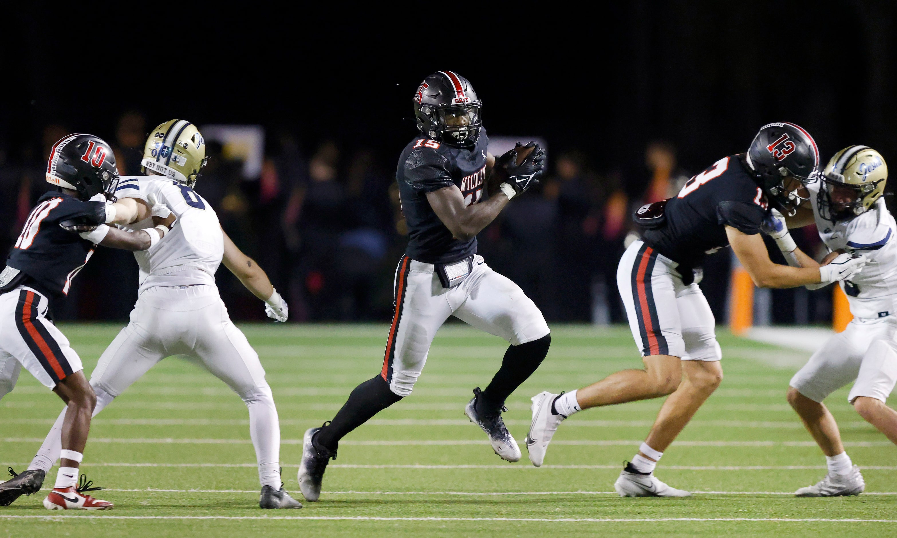 Lake Highlands High running back Christian Rhodes (15) finds room to run around the end...