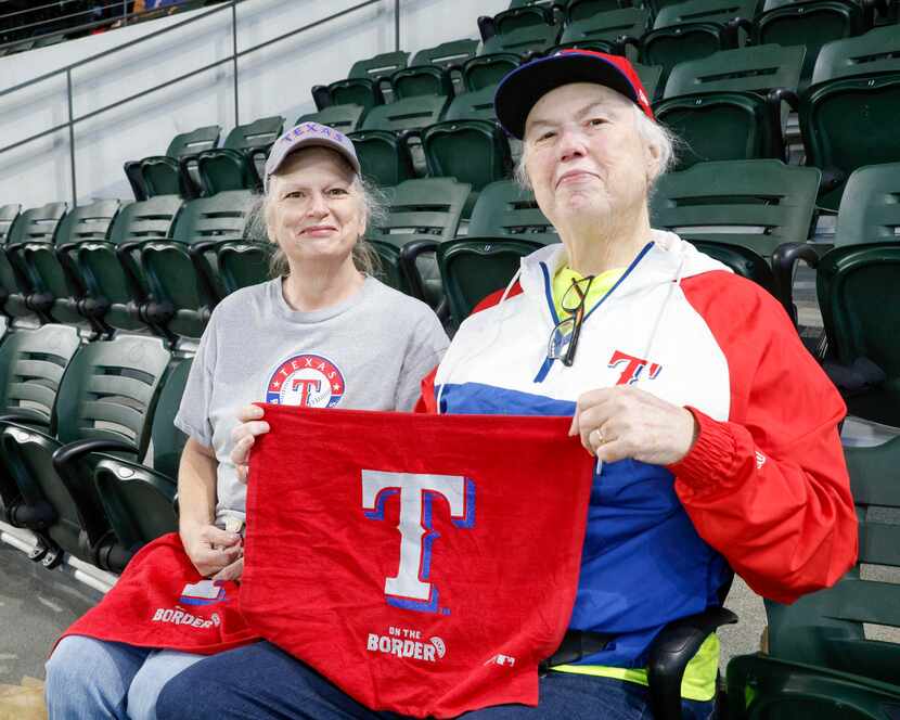 Theresa Poe (left) sits with Elaine Poe before Game 3 of the American League Championship...