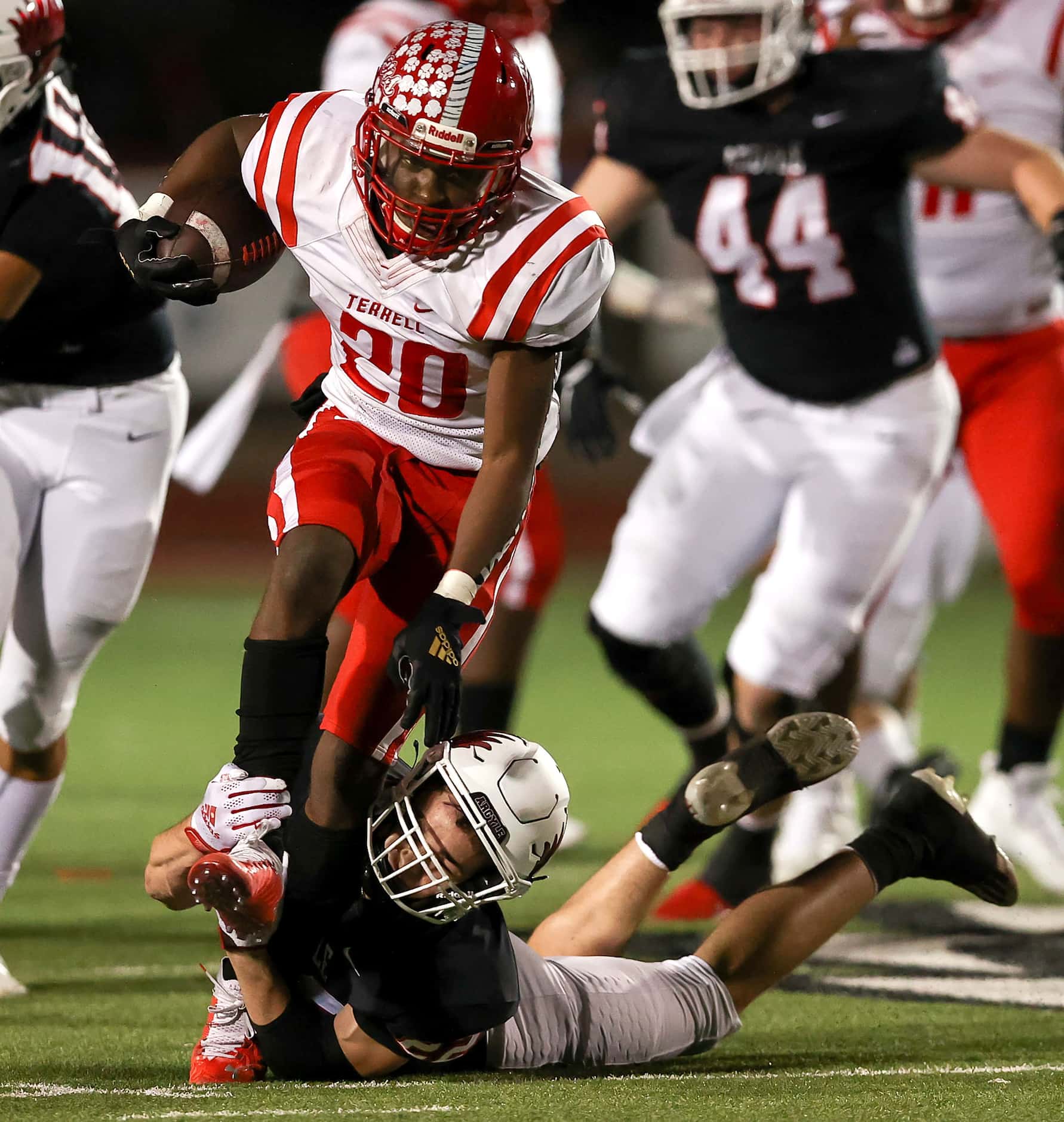 Terrell running back Chase Bingmon (20) tries to break a ankle tackle by Argyle defensive...