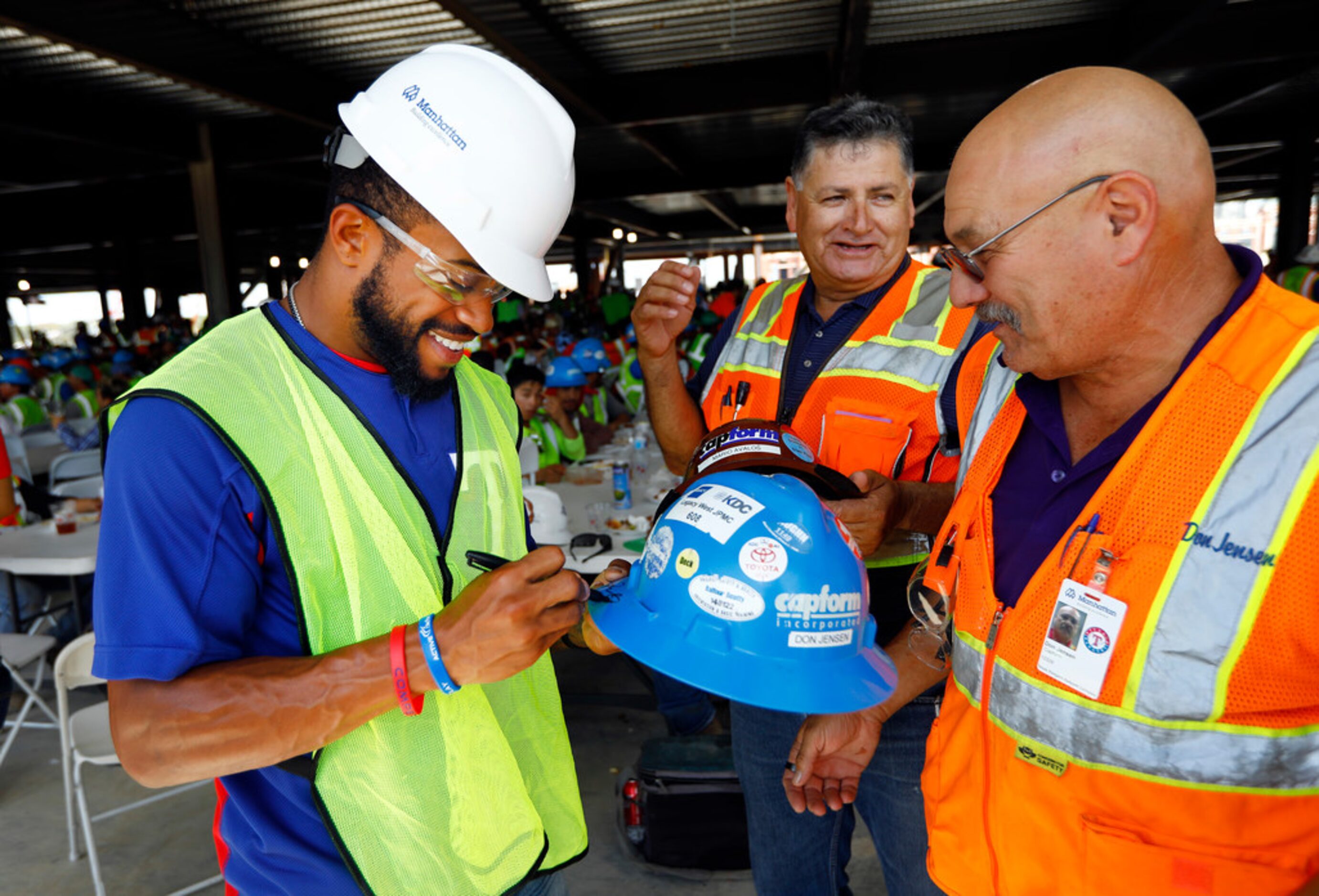 Texas Rangers outfielder Delino DeShields (left) signed construction worker Don Jensen's...