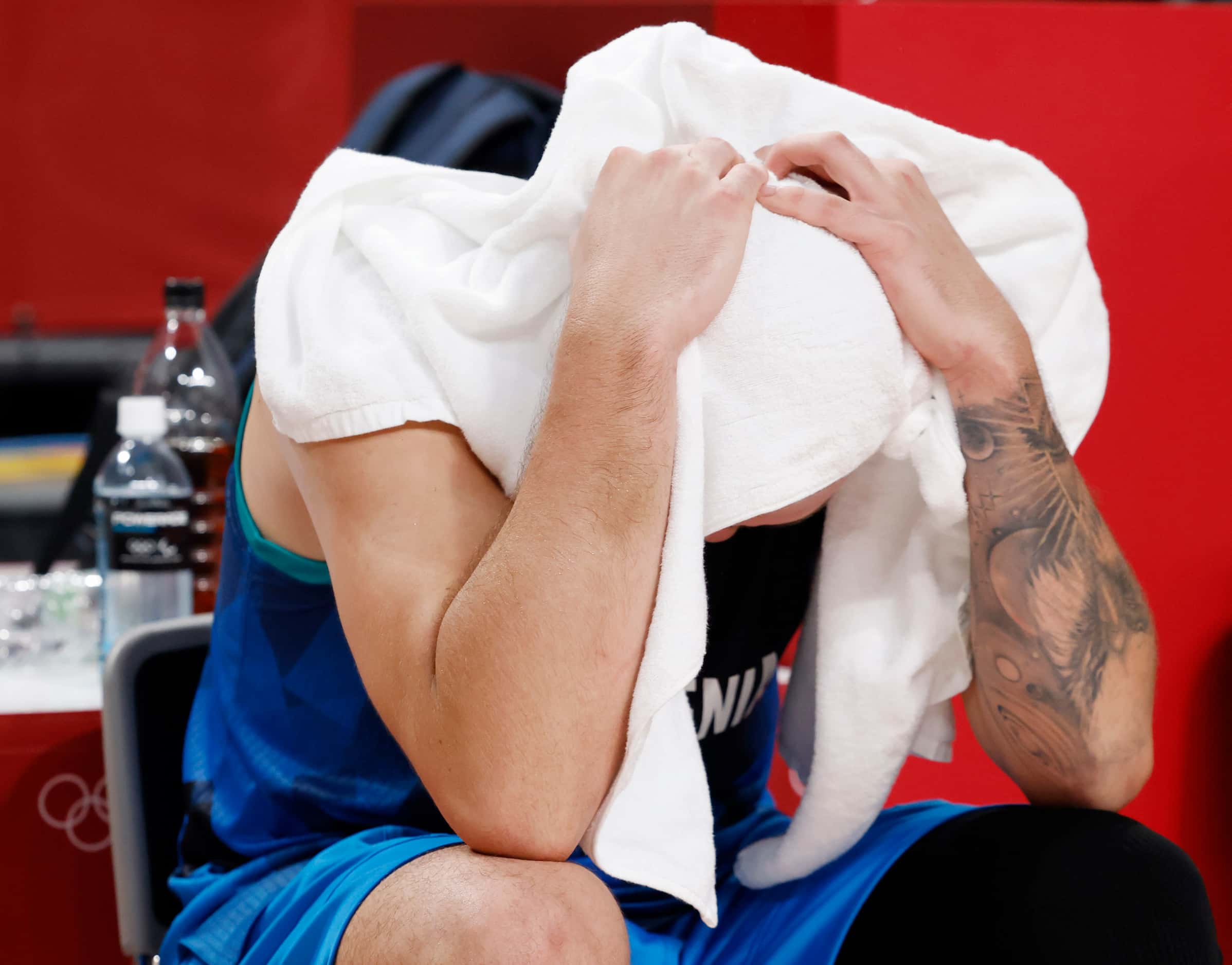 Slovenia’s Luka Doncic (77) sits dejected after losing to France 90-89 in a men’s basketball...