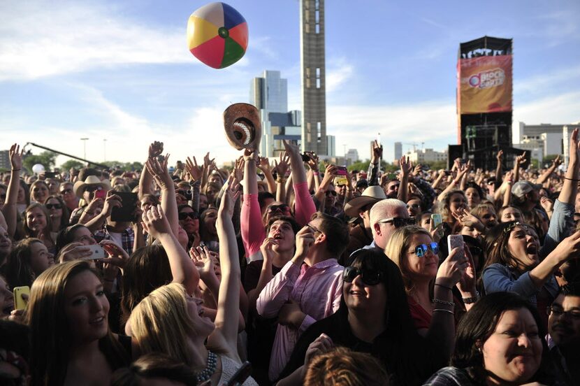 Fans throw a beach ball around at the 2014 NCAA March Madness Music Festival during the NCAA...