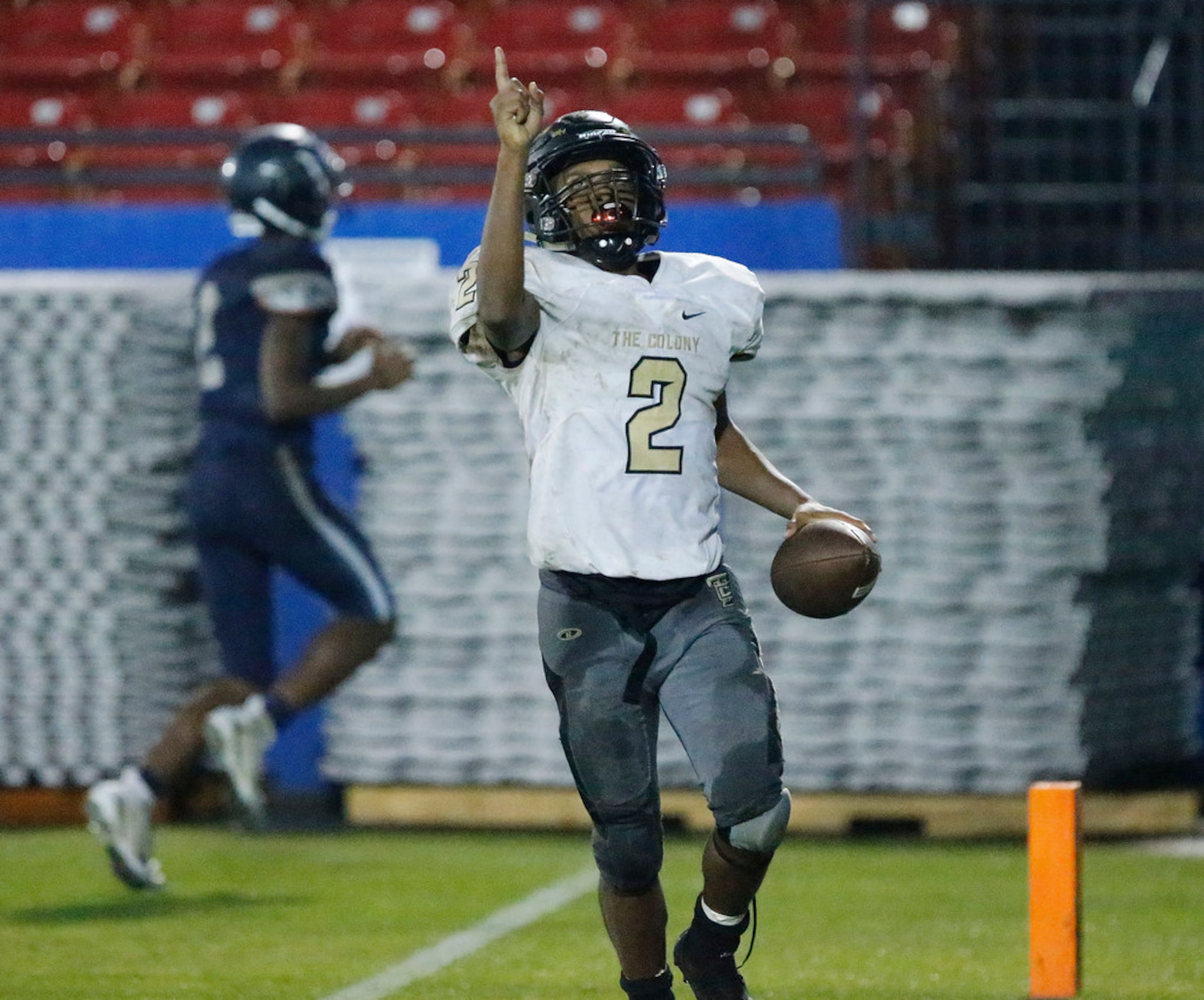 The Colony High School running back Myles Price (2) takes a lateral to the end zone to...