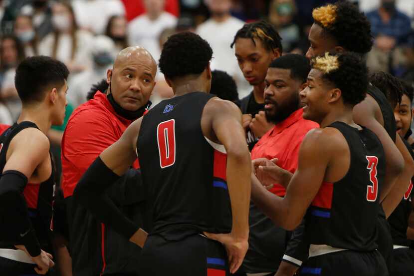 Duncanville Panthers head coach David Peavy listens to Caleb Ford (3) as he describes a play...