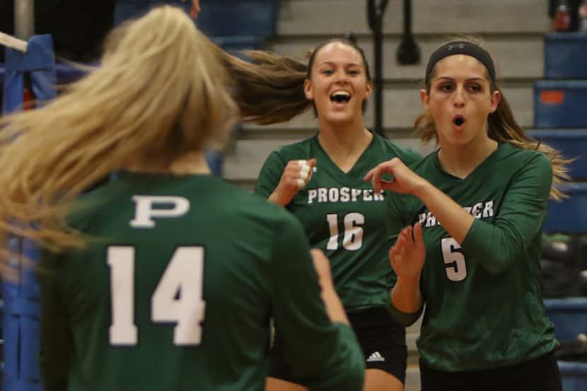 Prosper's Madi Whitmir (16) and Taryn Weber (5) react after scoring a point against...