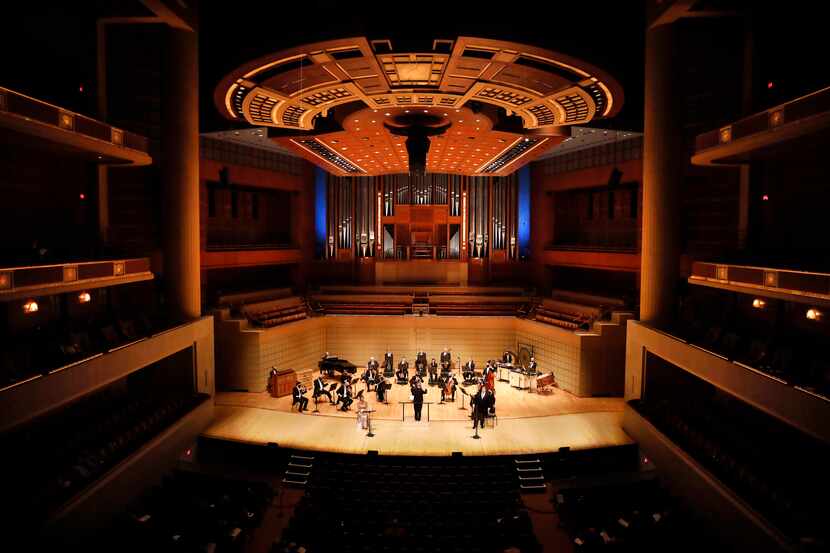 Music director Fabio Luisi (center) and his socially-distanced orchestra perform Mahler's...