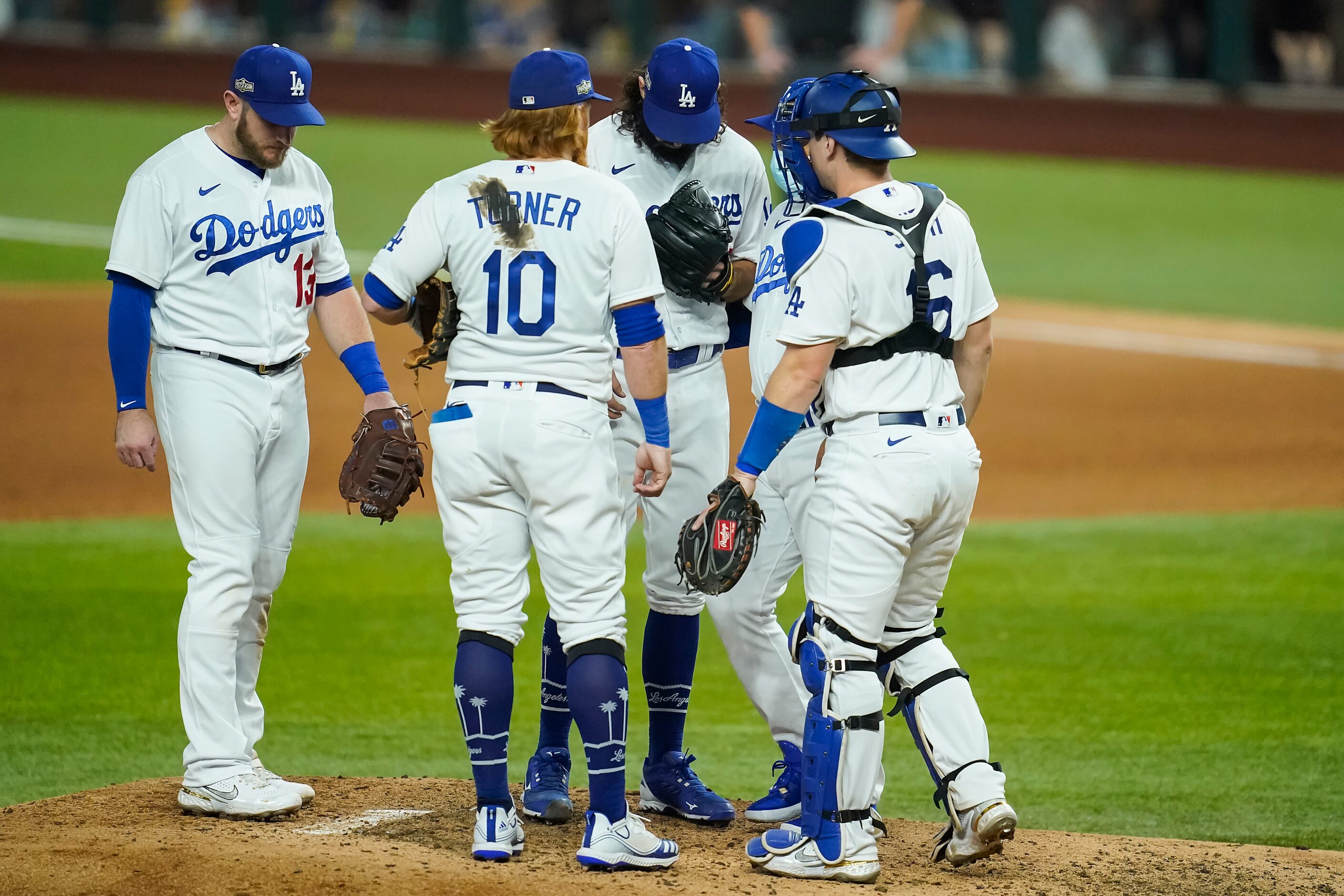 Los Angeles Dodgers pitcher Tony Gonsolin is removed from the game by manager Dave Roberts...