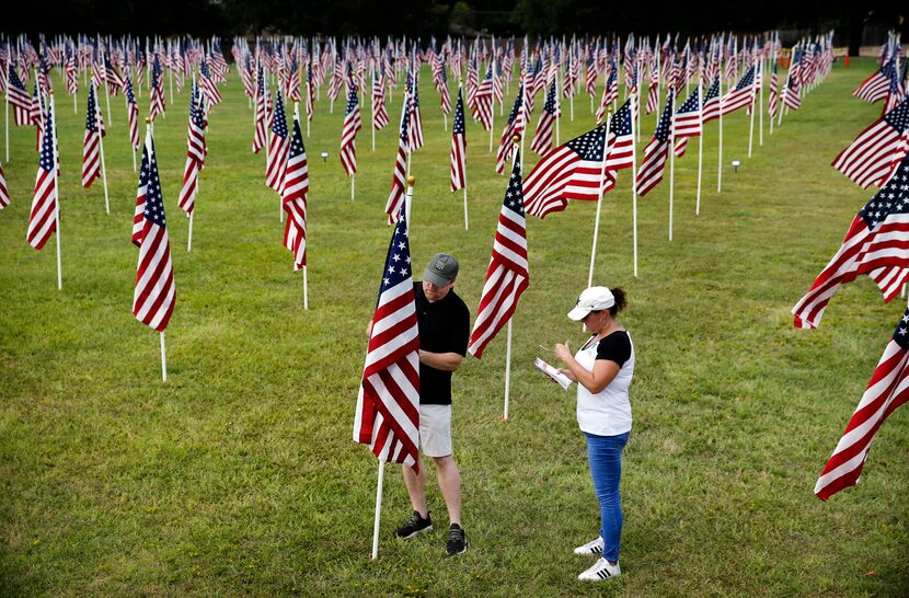 Volunteers Jack Webb of Arlington Veterans Business Council and Jessica Halfaker of Joe Hall...