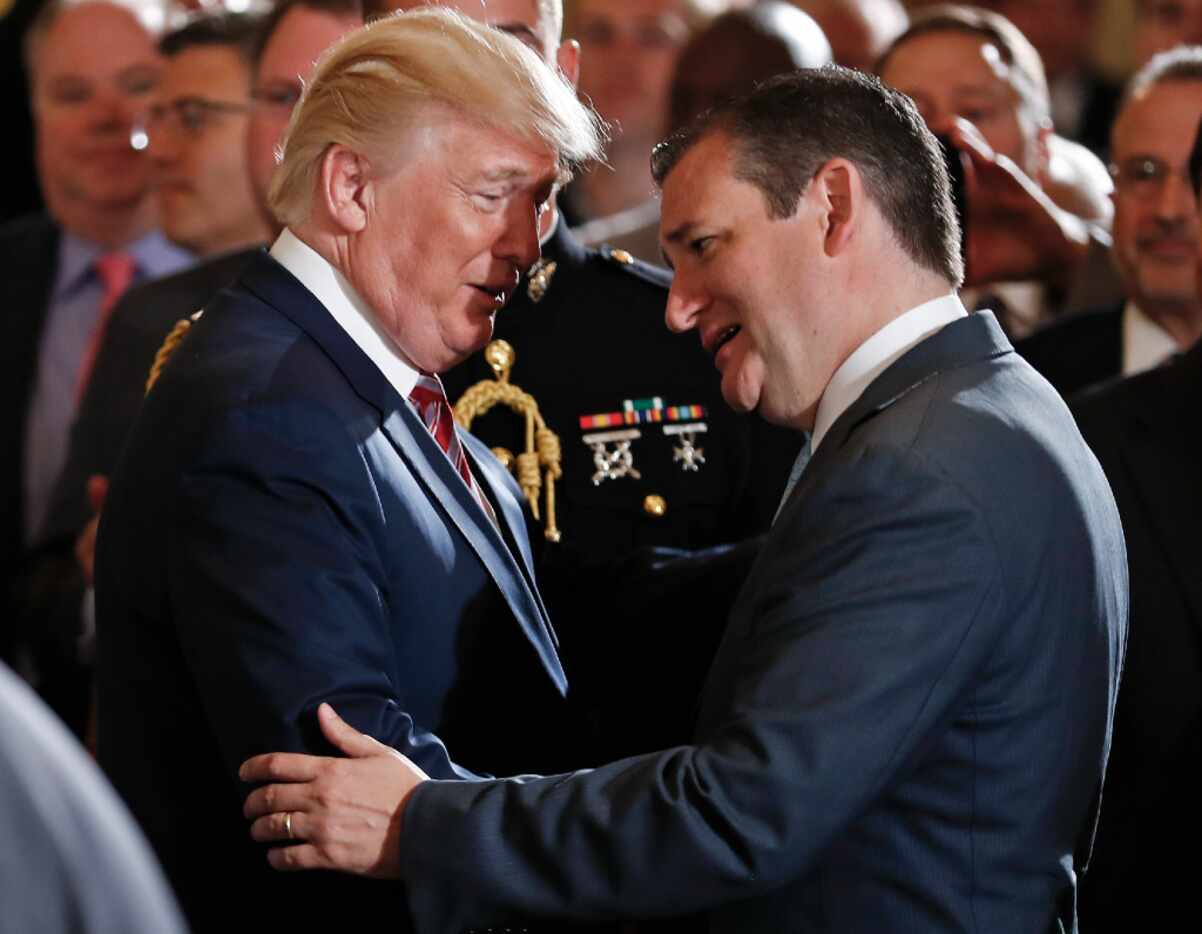 President Donald Trump talks with Sen. Ted Cruz in the East Room at the White House on June...