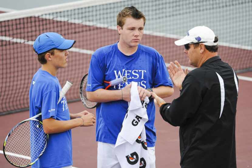 Plano West tennis coach Morgan Walker, right, talks to Andrew Fuller, left, and Daniel...
