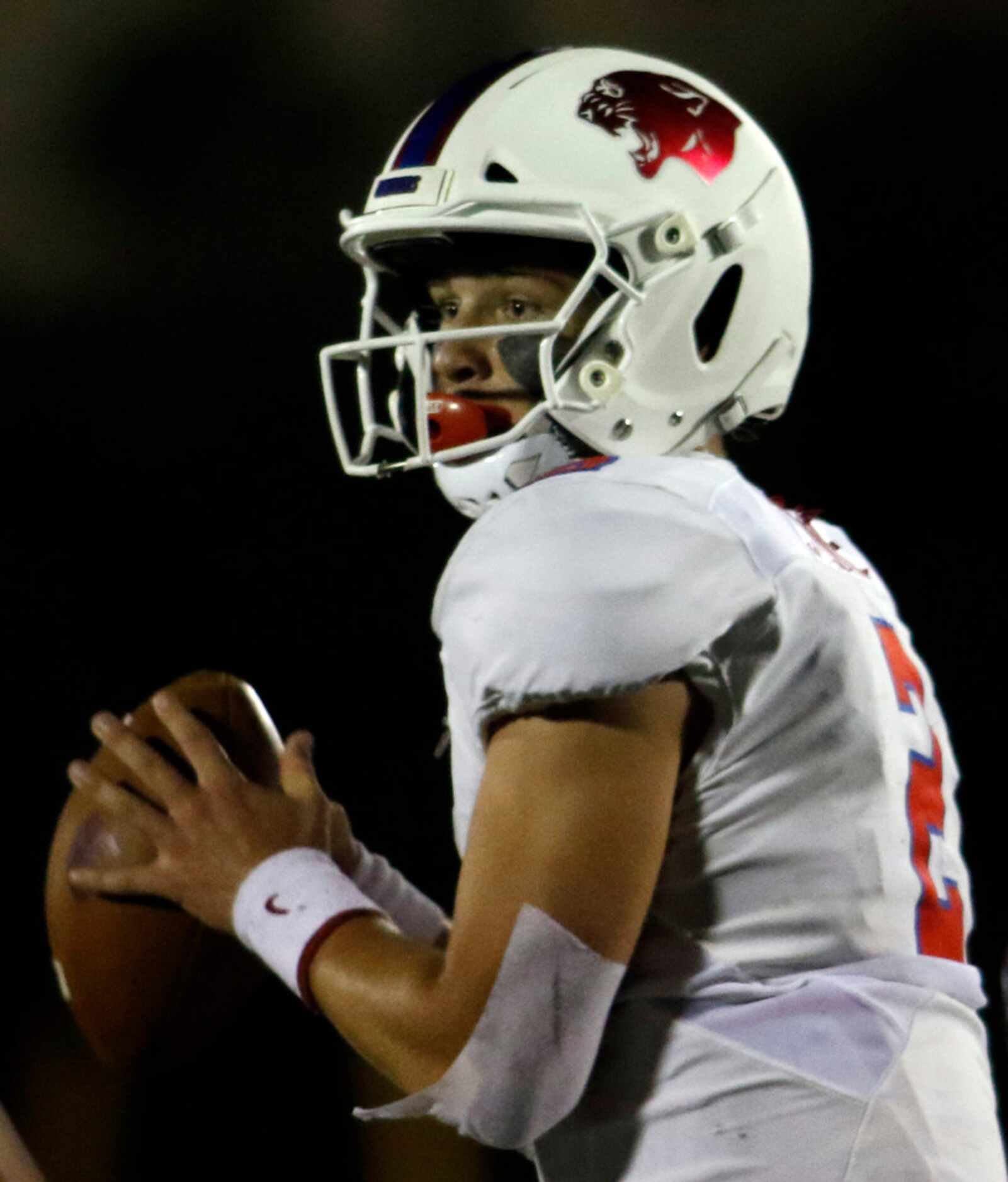 Parish Episcopal quarterback Preston Stone (20 looks to pass during first half action...