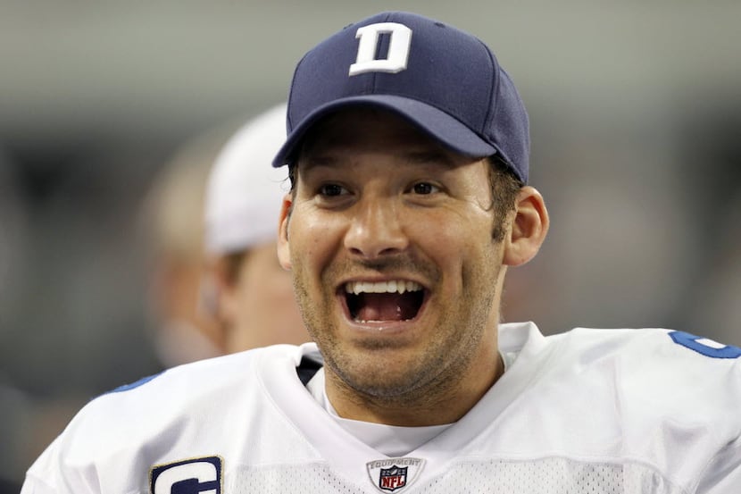 Dallas Cowboys quarterback Tony Romo (9) is all smiles late in the second half of play...