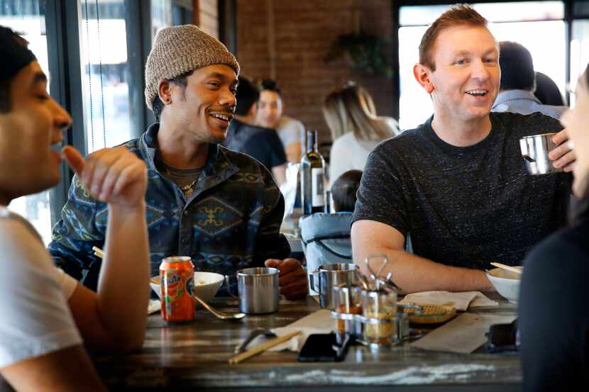 Diners share laughs over lunch at the Khao Noodle Shop, a tiny spot in East Dallas where...