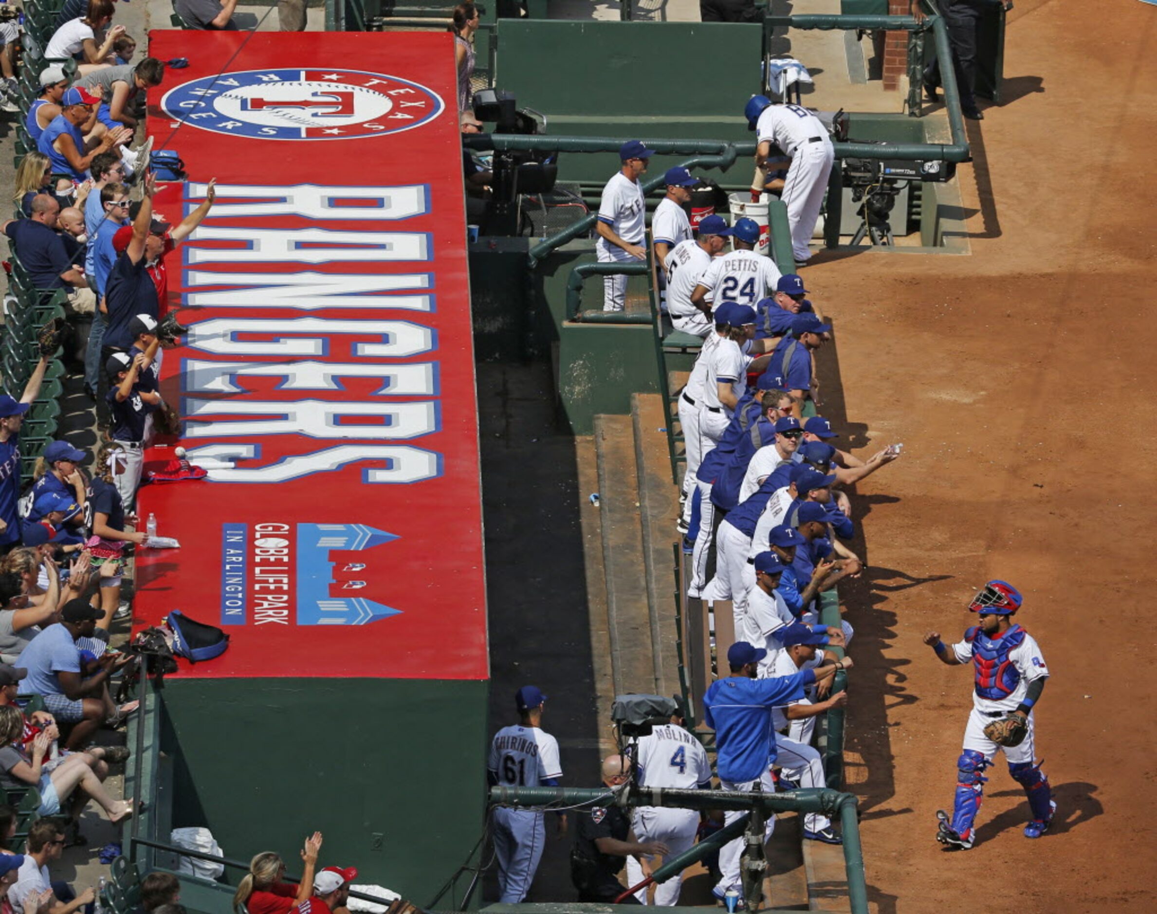 The Rangers dugout is pictured in the first inning during the Oakland Athletics vs. the...