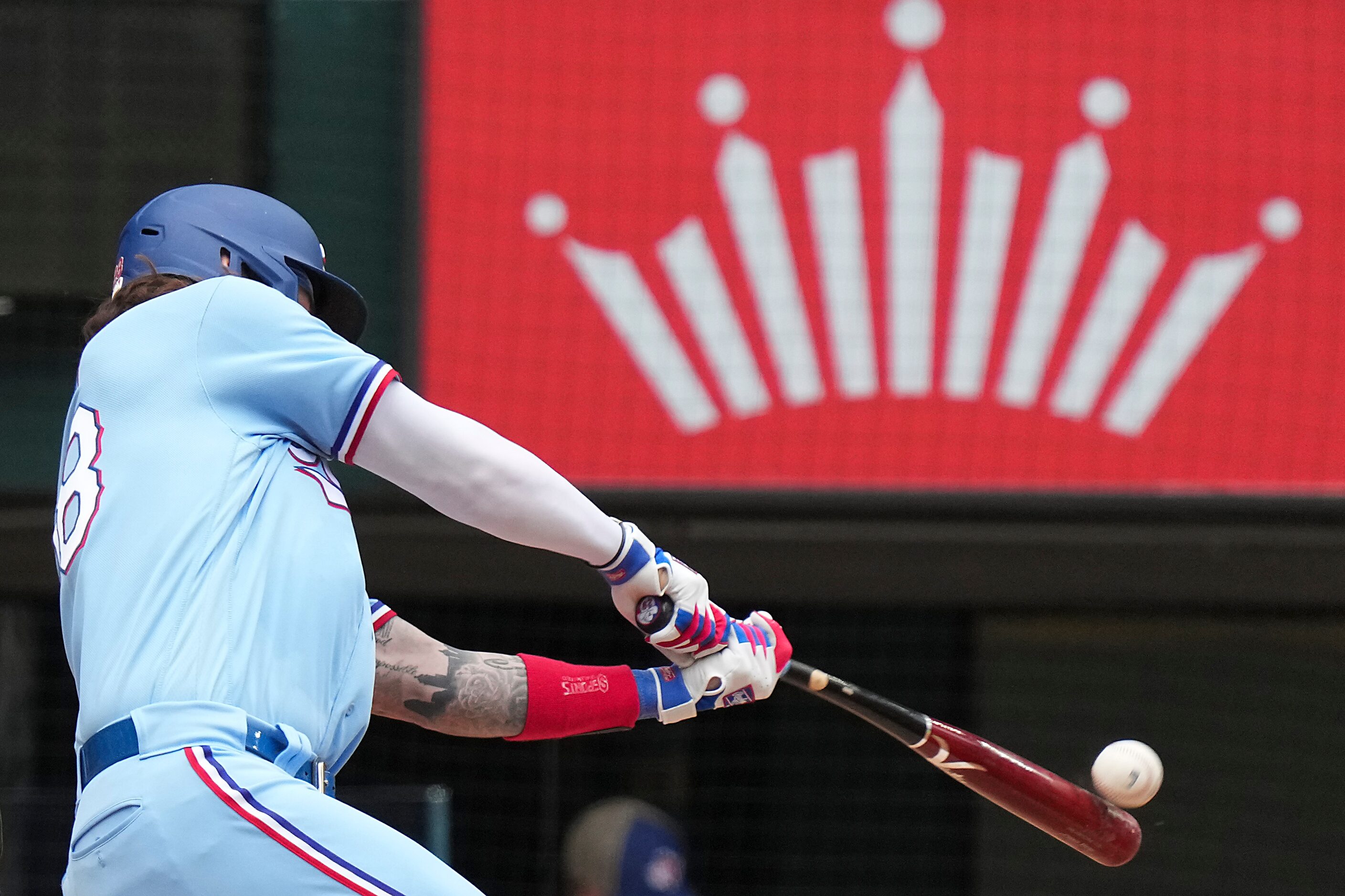 Texas Rangers catcher Jonah Heim drives in run with a single during the fifth inning against...