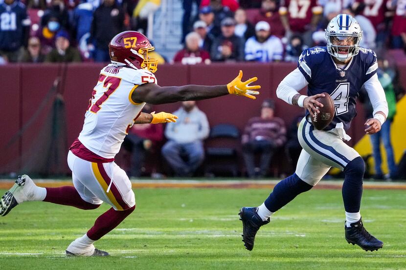 Dallas Cowboys quarterback Dak Prescott (4) scrambles past Washington Football Team...