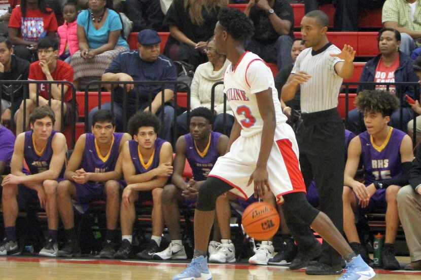Dallas Skyline guard Marcus Garrett (23) gains the attention of the Richardson bench as he...