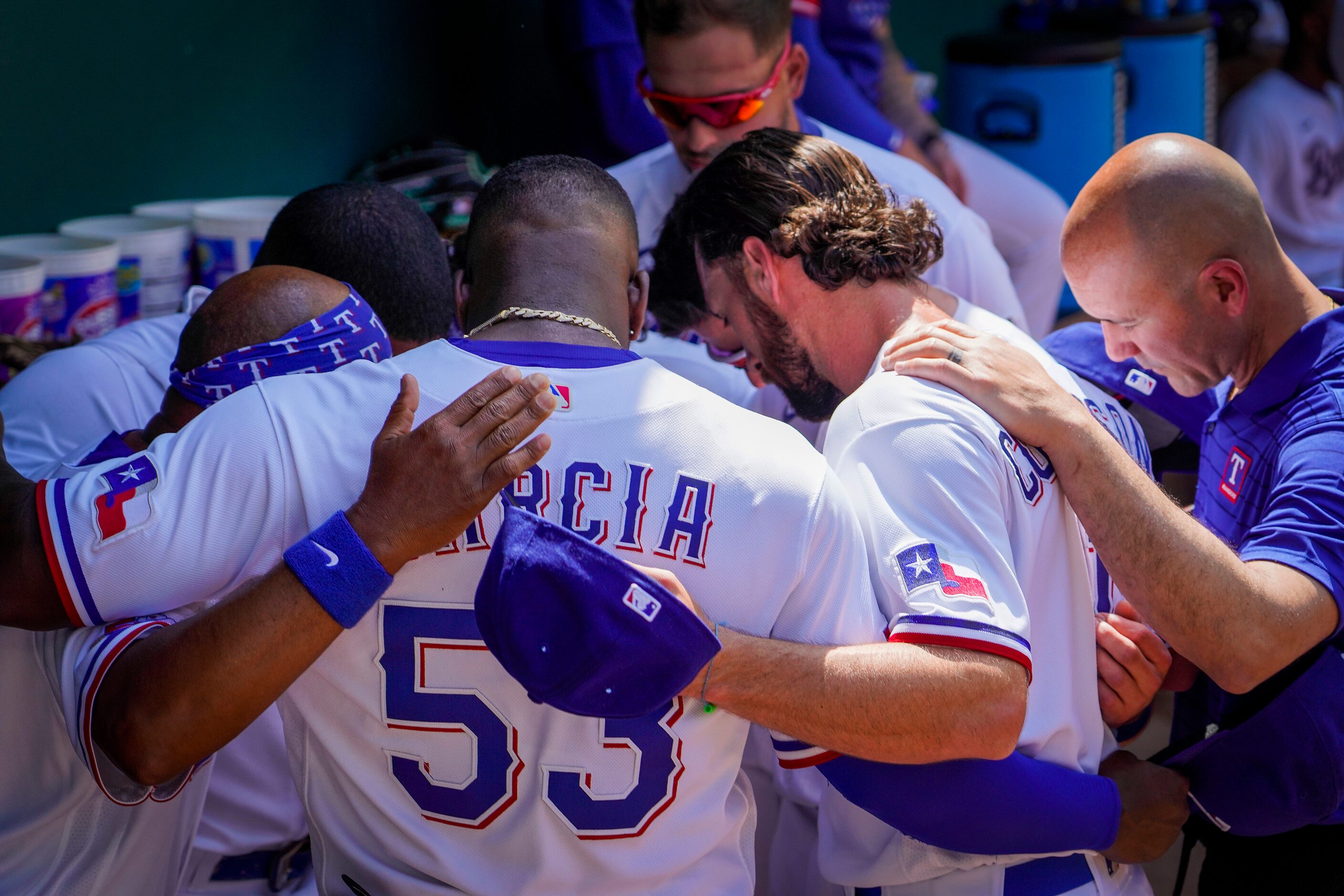 Texas Rangers players, including center fielder Adolis Garcia (53) and infielder Charlie...