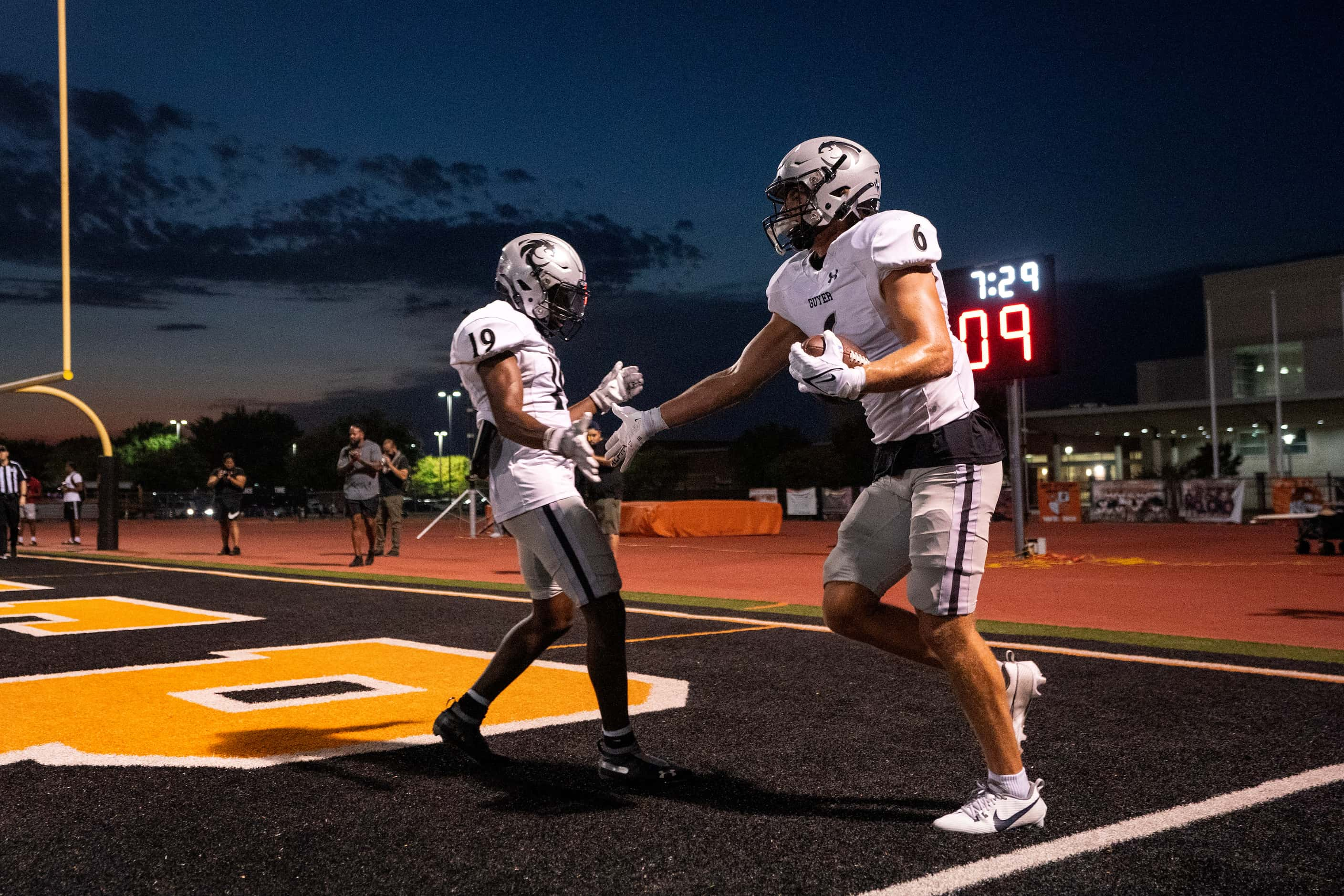 Denton Guyer sophomore wide receiver Corbin Glasco (19) congratulates senior wide receiver...