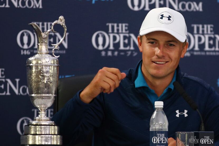 Jordan Spieth of the United States smiles during a press conference after winning the...