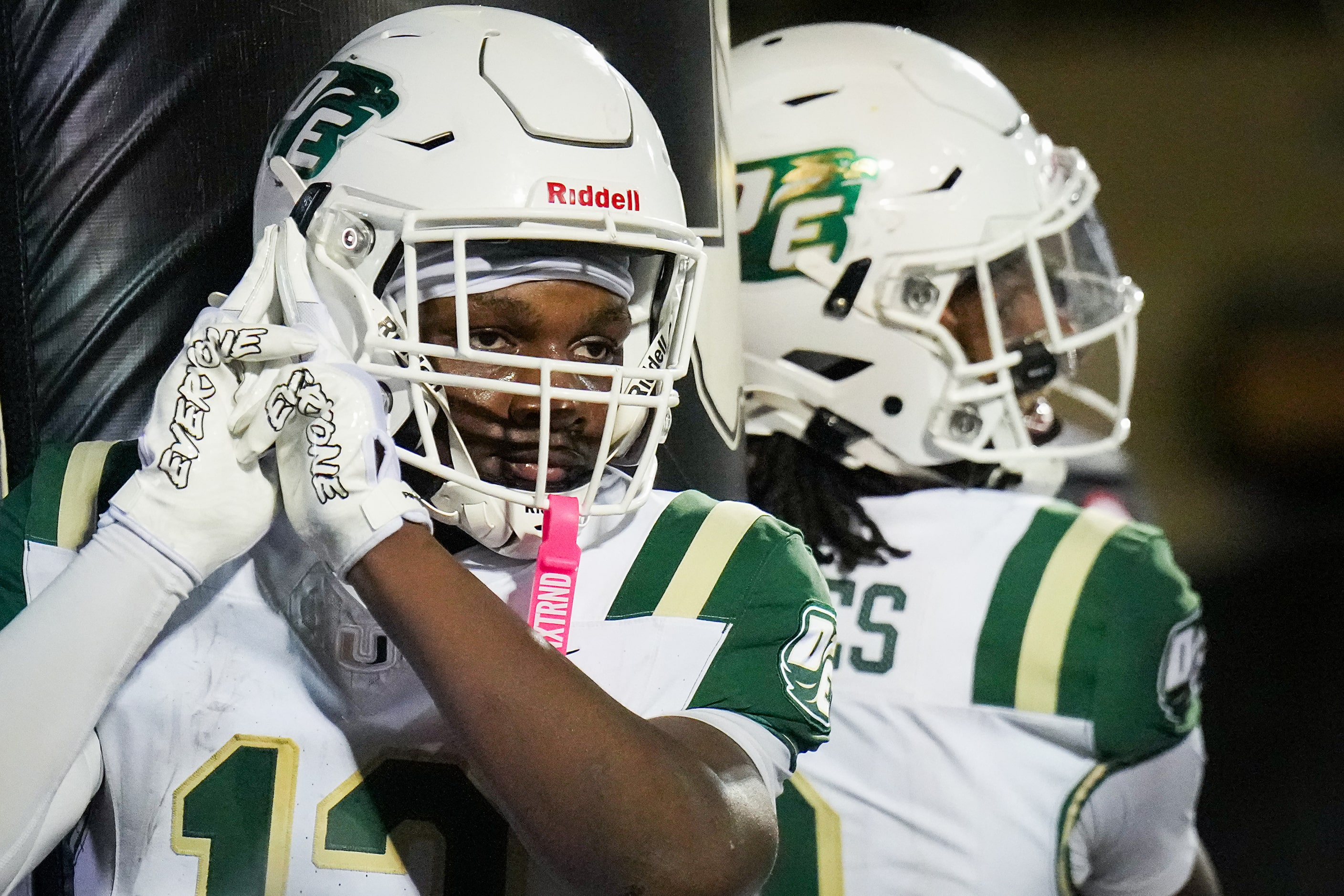 DeSoto running back SaRod Baker (12) celebrates with quarterback Kelden Ryan  after...