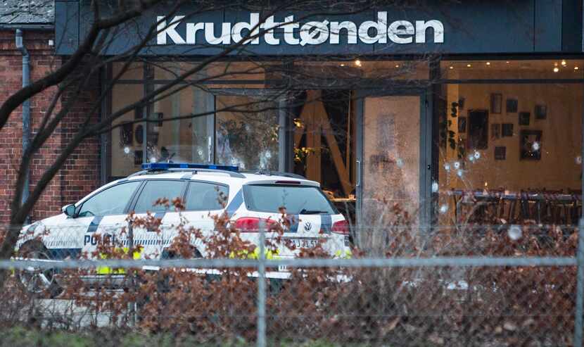 The scene outside the Copenhagen cafe, with bullet marked window, where a gunman opened fire...