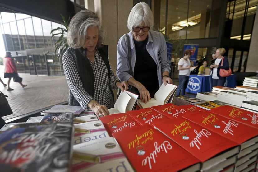 Joyce Dorsey (left) and her friend Jen Carrick take a look at books at the the Wild...