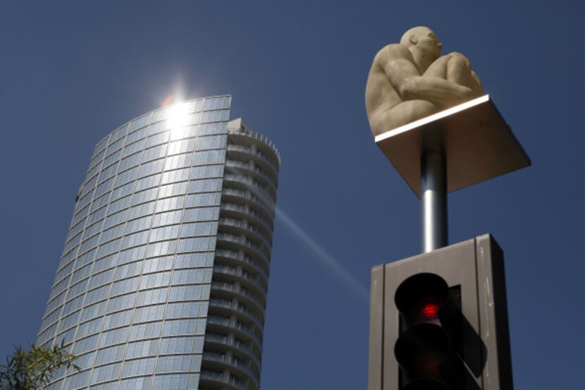 Light reflected off Museum Tower just outside the Nasher Sculpture Center this week. Mayor...