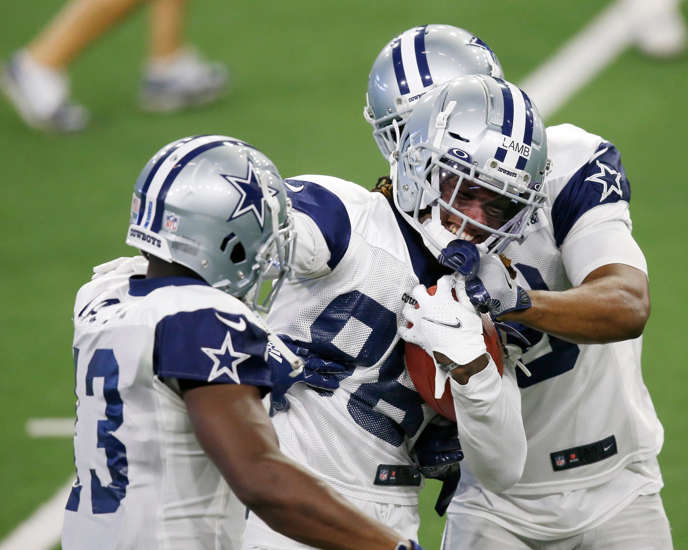 Dallas Cowboys wide receiver CeeDee Lamb (88) keeps a grip on the ball as Dallas Cowboys...