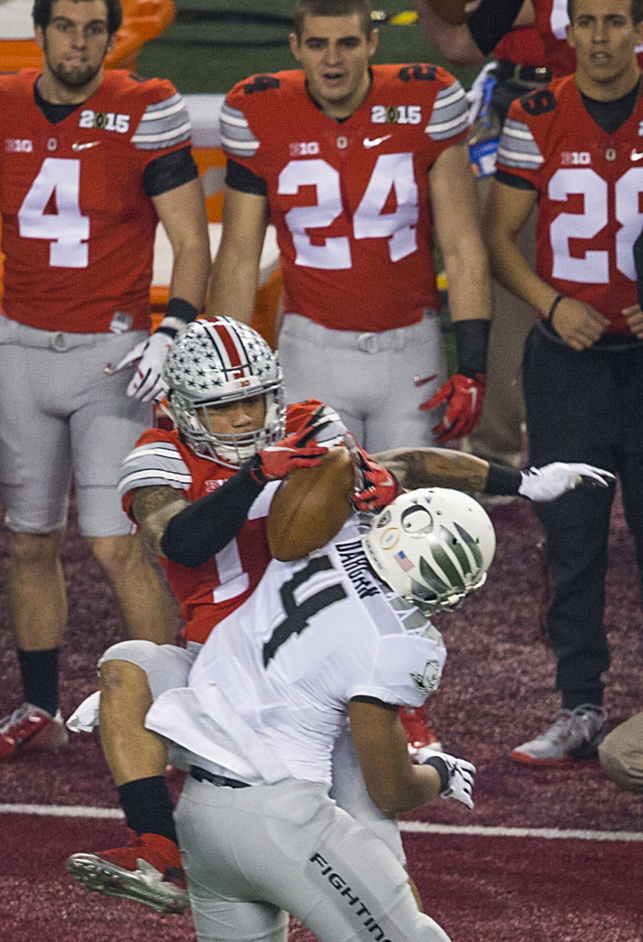 Ohio State Buckeyes running back Jalin Marshall (17) makes a catch over Oregon Ducks...