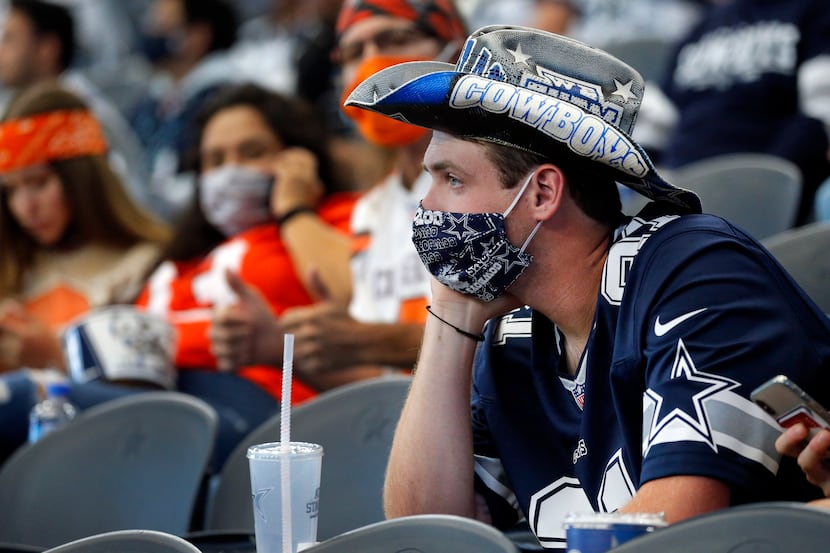 Dallas Cowboys fan Johnathan Threet of Lindale, Texas watches as his team falls further...