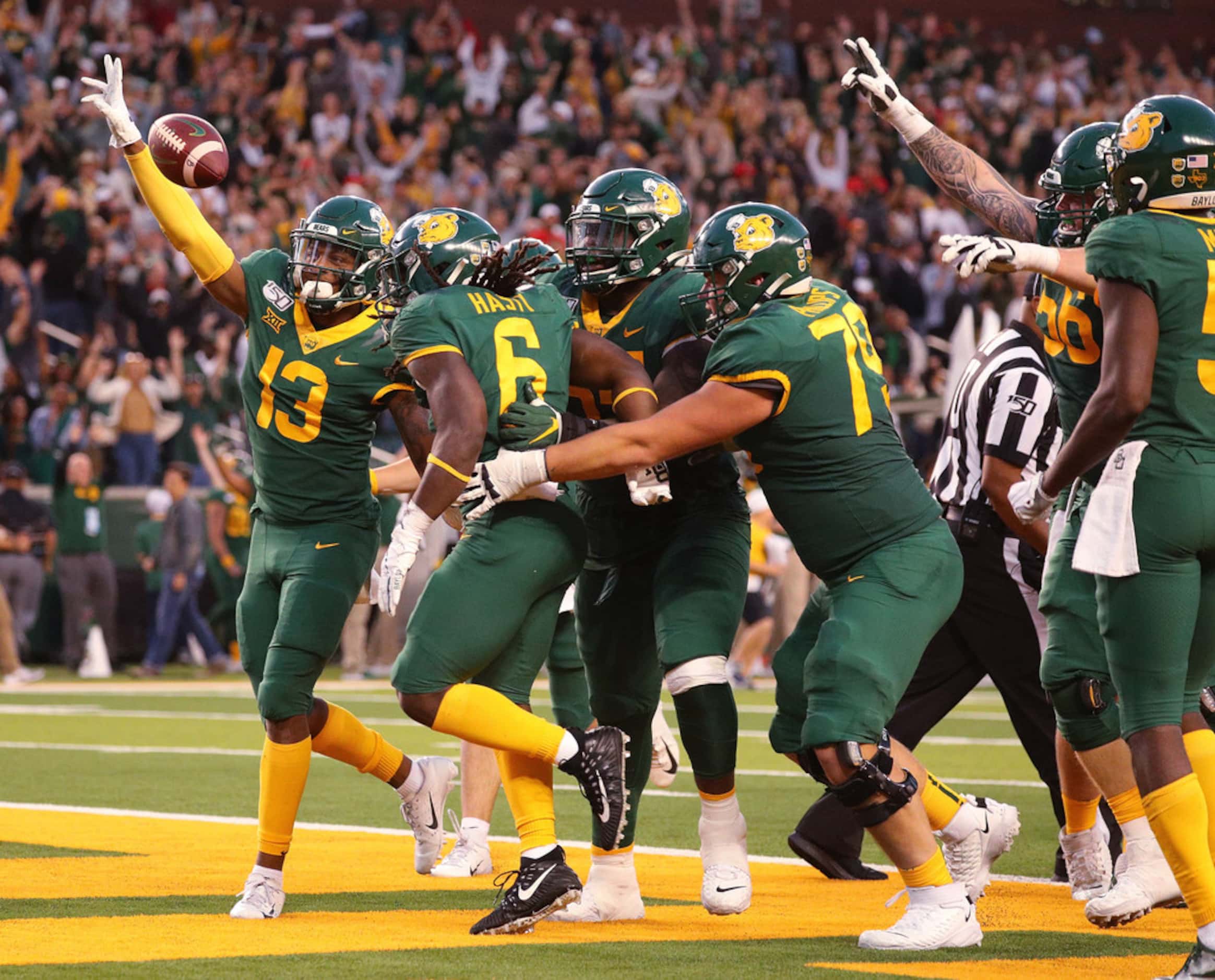 WACO, TEXAS - OCTOBER 12: The Baylor Bears celebrate the overtime win against the Texas Tech...